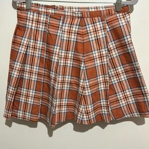 Women’s orange plaid skirt